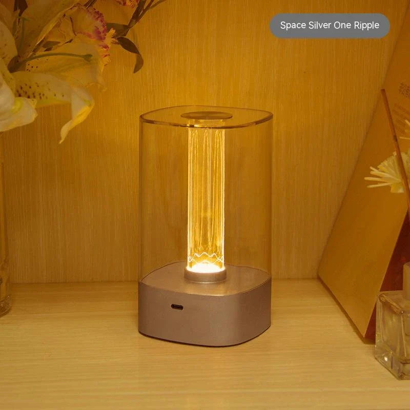 Elegant touch-controlled bedside lamp with soft, warm lighting, unique lamp post design, and wireless USB charging