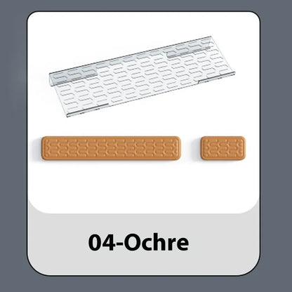 Double-sided black and grey keyboard mouse pad with wrist strap and hand pillow on a desk.