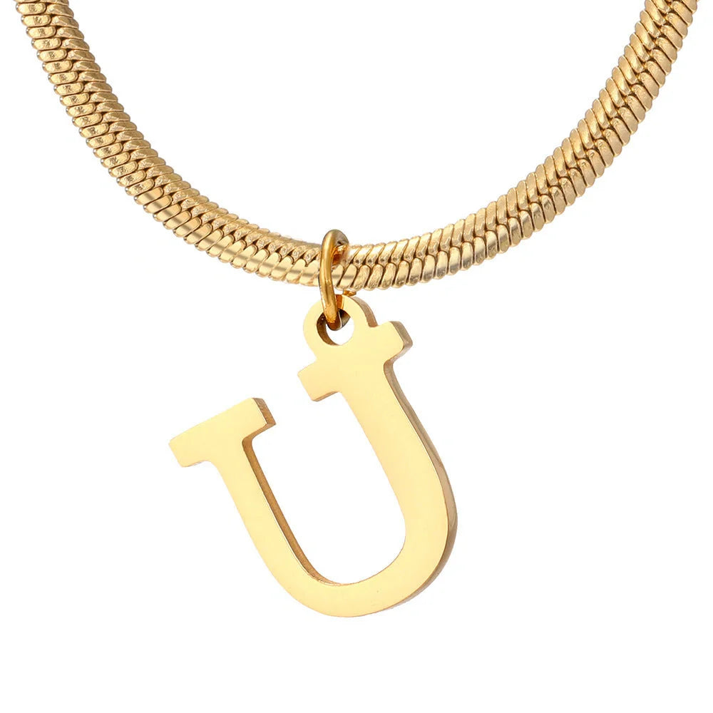 Elegant gold A-Z letter pendant necklace on a snake chain