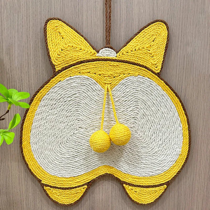 Yellow Corgi-butt design sisal cat scratching pad with anti-slip base, shown with adhesive hooks for wall mounting.
