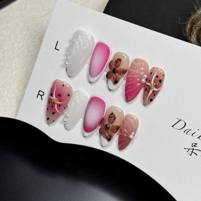 Hand-painted nail patches with three-dimensional carved embossed candy patterns in almond shape