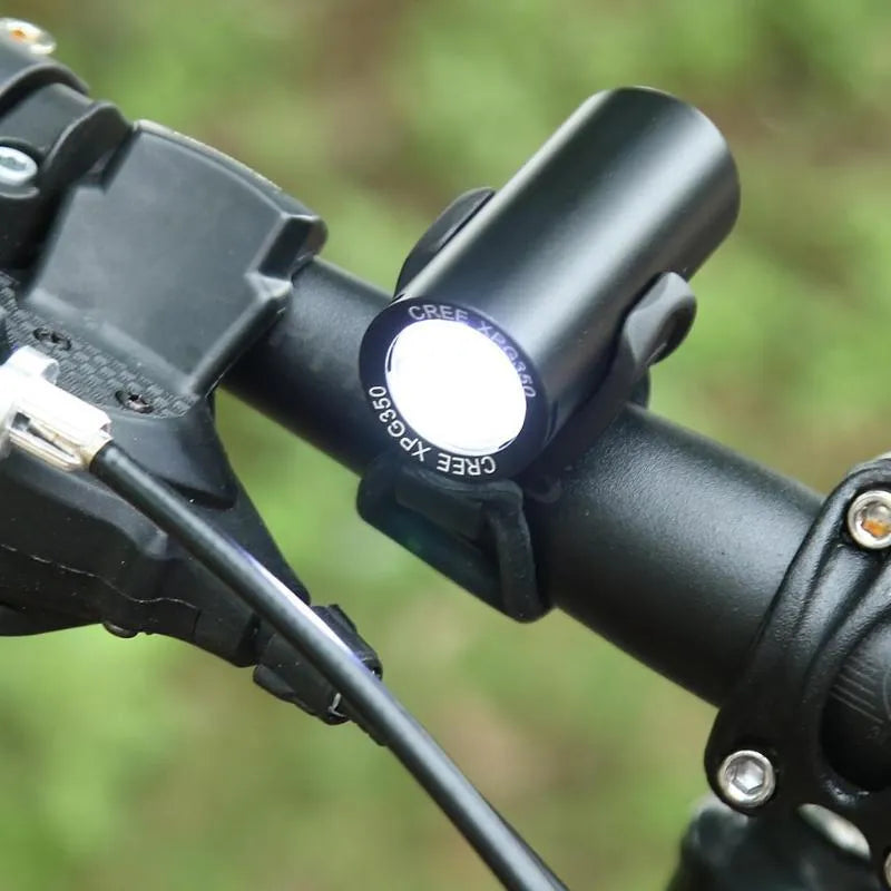Black USB rechargeable bicycle front light showing 350 lumen output