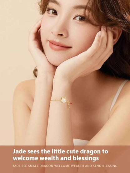 Silver-plated dragon zodiac bracelet for women with Hetian jade accents on a white background.