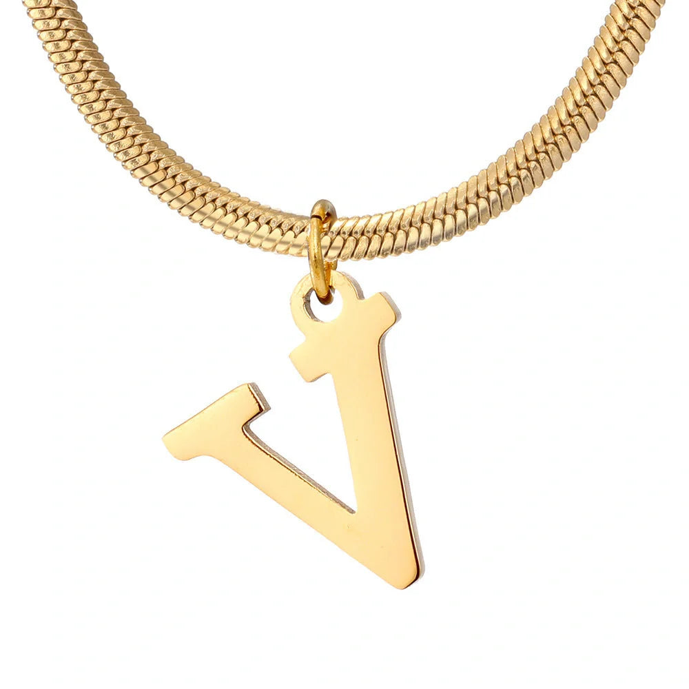 Elegant gold A-Z letter pendant necklace on a snake chain