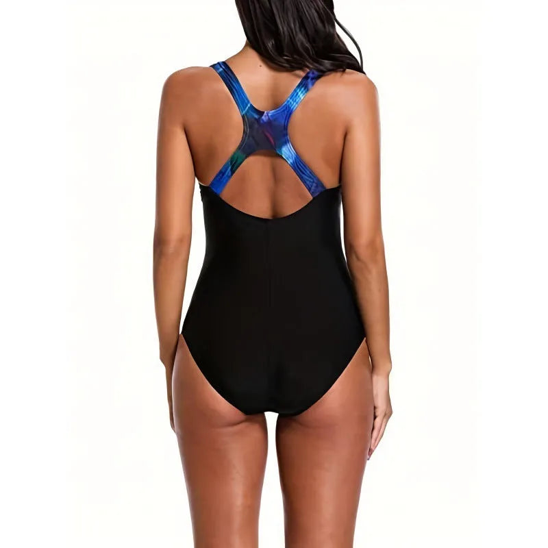 Women's oversized one-piece swimsuit in a printed floral design, showing backless style.