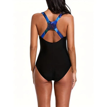 Women's oversized one-piece swimsuit in a printed floral design, showing backless style.