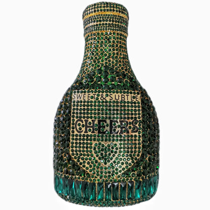 Gold hard-shell clutch bag shaped like a champagne bottle with a synthetic leather interior.