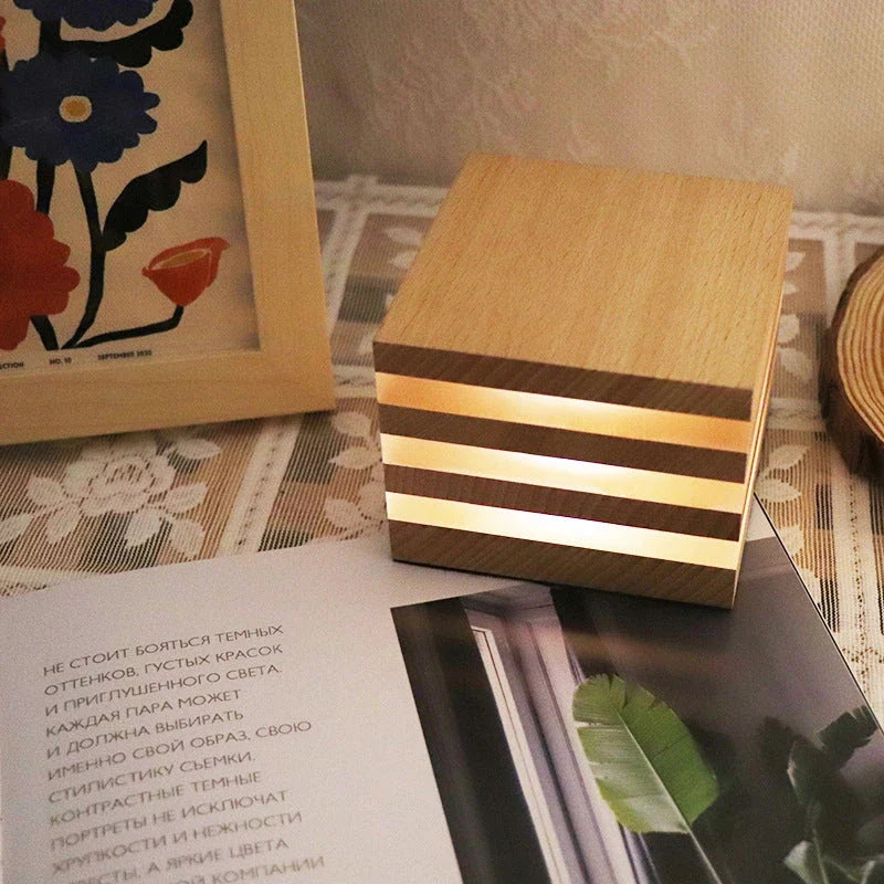 A warm, Scandinavian-inspired wooden LED night light in the shape of a heart or small house, providing cozy illumination for any room