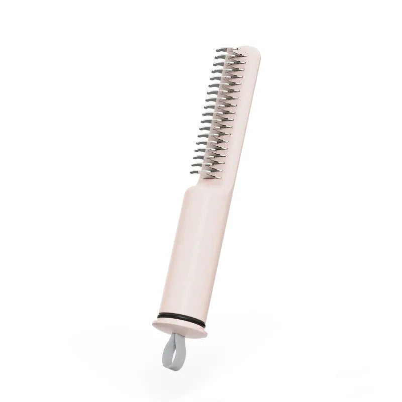 Pink and white stainless steel dematting comb for dogs on a plain background.