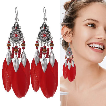Round drop feather earrings in a bohemian leaf shape with patterned detail, shown in a light pink electroplated colour.