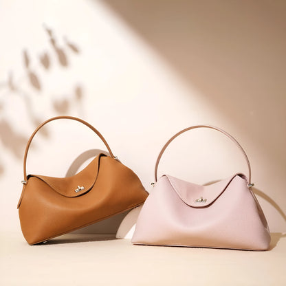 Cowhide leather shoulder messenger bag in a pillow shape with an open pocket and adjustable double straps.