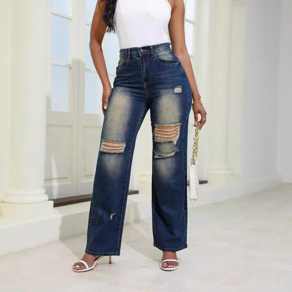 High-waisted ripped jeans with pockets in light green and navy blue colors, featuring a slim, straight leg silhouette and comfortable cotton-silk blend fabric
