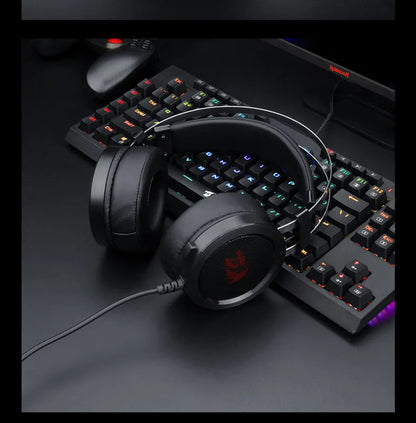 Black wired computer gaming headset with over-ear cups and a 3.5mm jack.