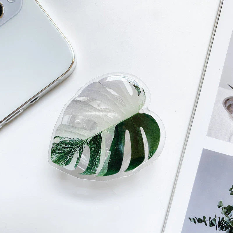 Stylish smartphone stand with leaf-inspired design for secure hands-free support and mobile device versatility