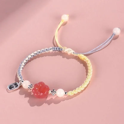 Handmade red cat's paw charm bracelet with glass beads in pink or yellow woven design