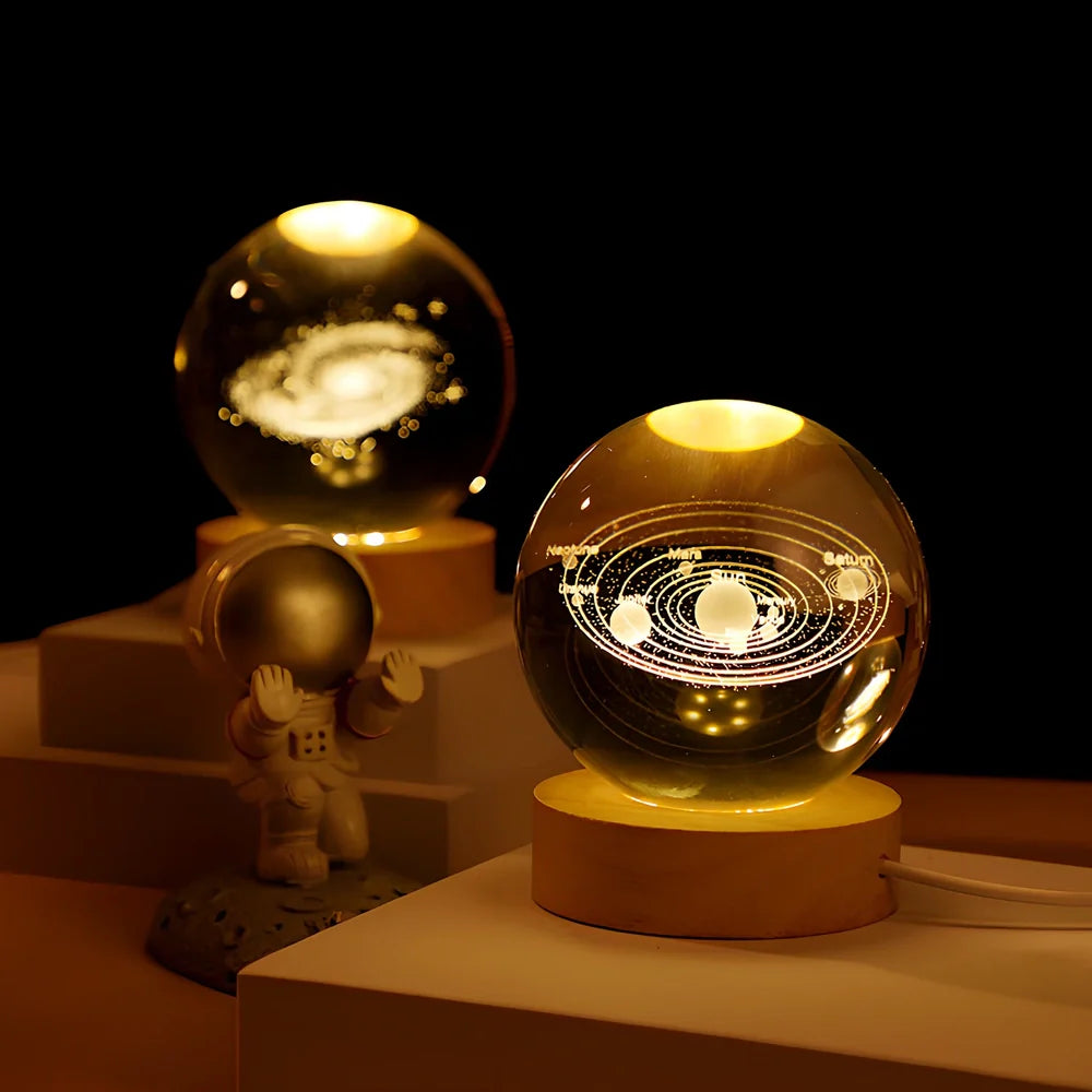 Cosmos Series crystal ball night light with wooden base and astronaut figure, showing Milky Way light pattern