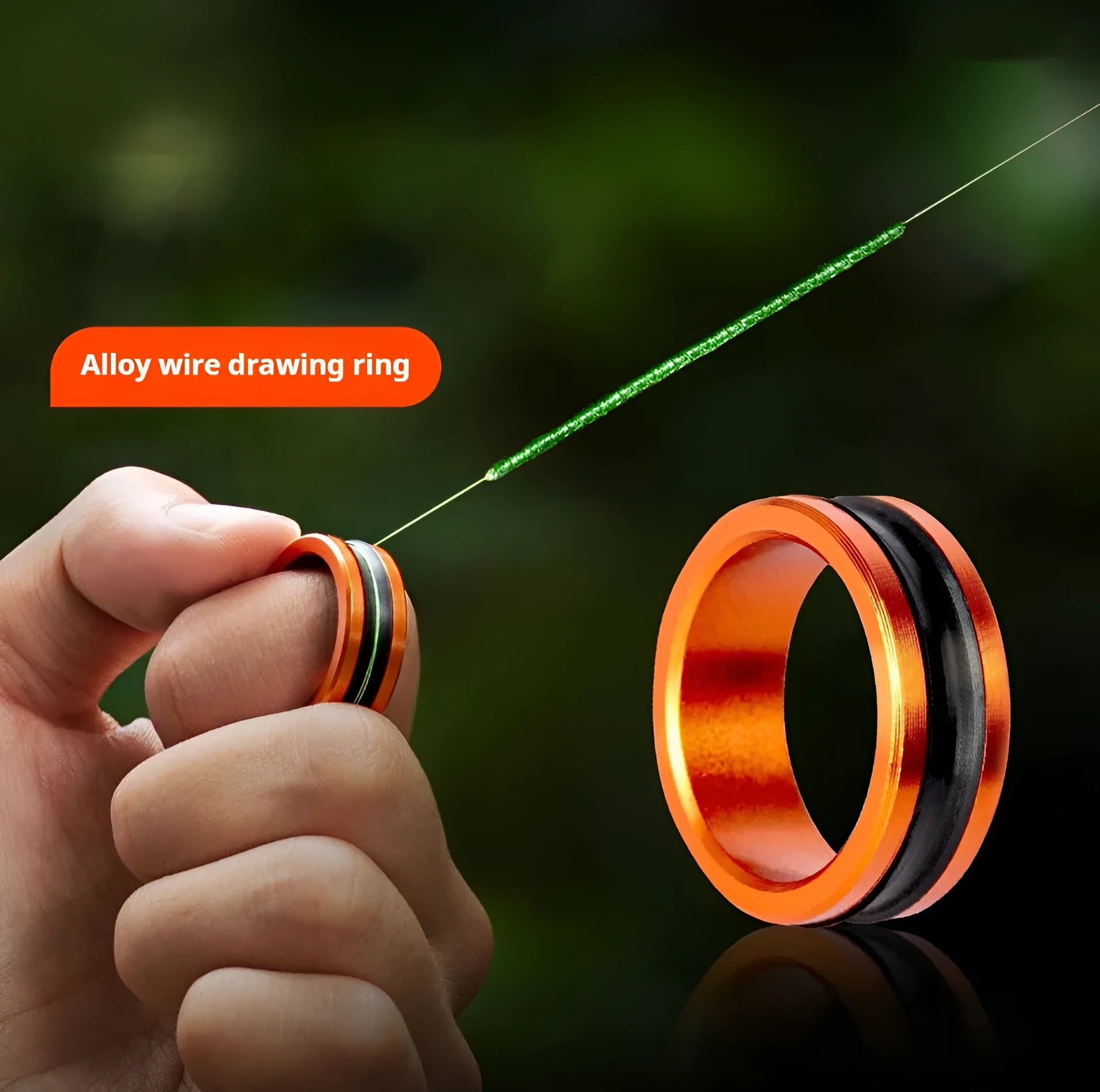 Orange and silver alloy fishing hand guard with non-slip pull loop