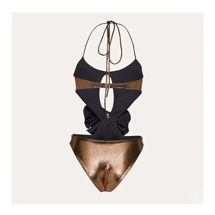 Gold handmade halter one-piece swimsuit with hollow out floral pattern on a mannequin.