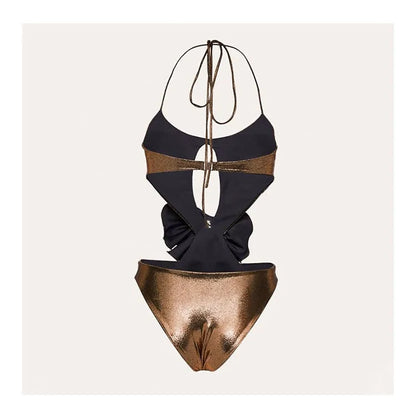 Gold handmade halter one-piece swimsuit with hollow out floral pattern on a mannequin.