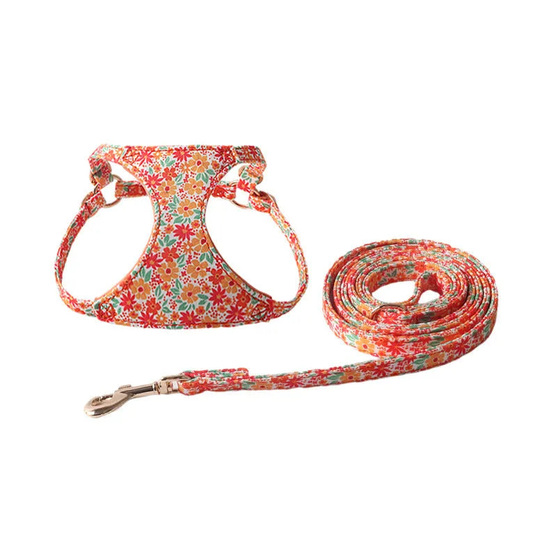 Orange cloth dog harness and leash set from the floral series, showing the single chest back design.