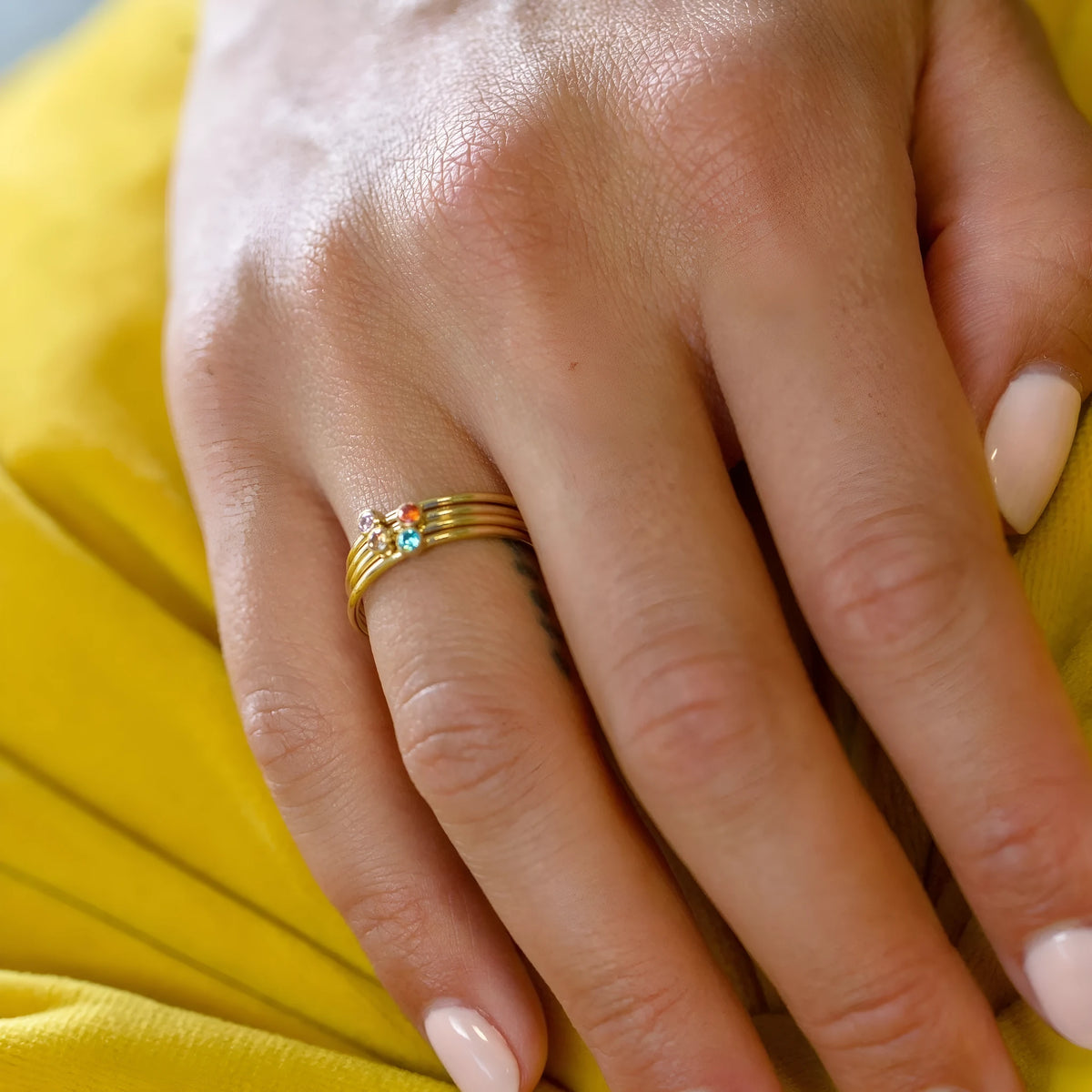 December birthstone titanium steel ring with geometric design and engraving on finger