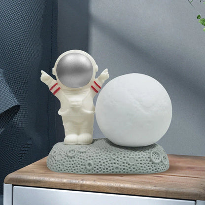 Astronaut-shaped night lamp with colour-changing LED and detachable design