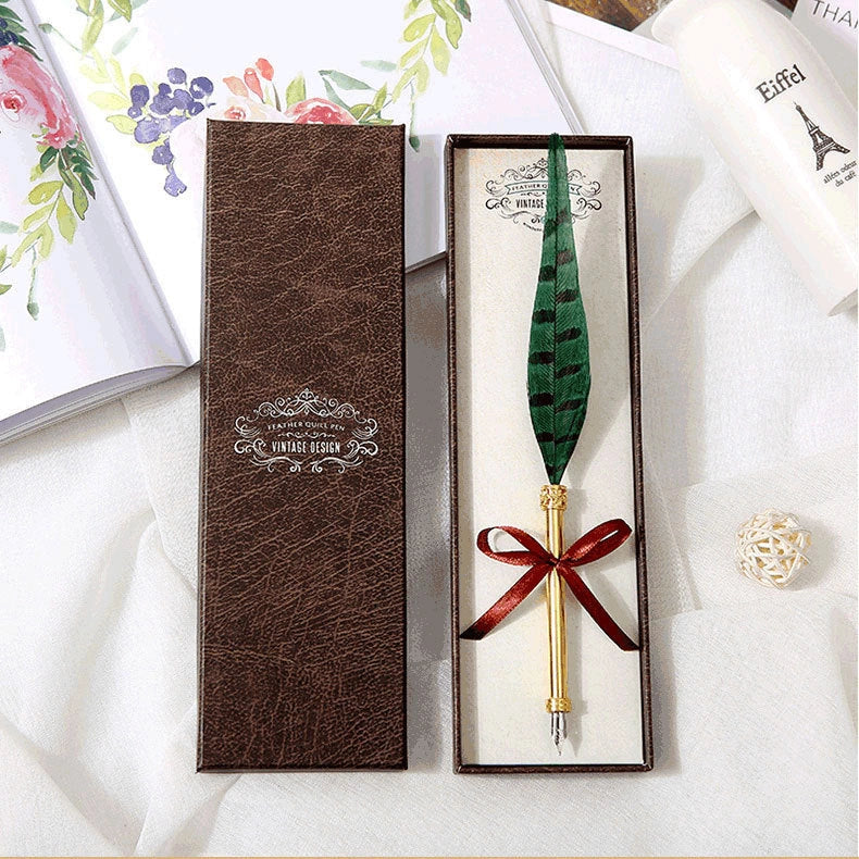 Elegant retro feather pen in a luxury gift box, featuring a sleek stainless steel casing and a stunning array of authentic feather designs.
