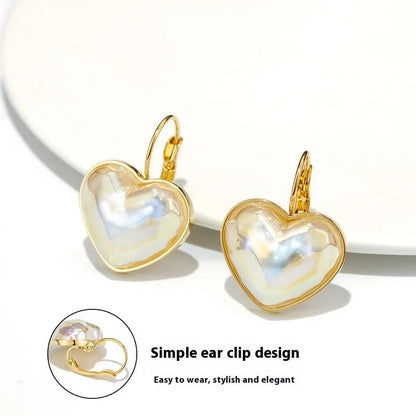 Gold-coloured alloy clip-on earring for women with a natural design.