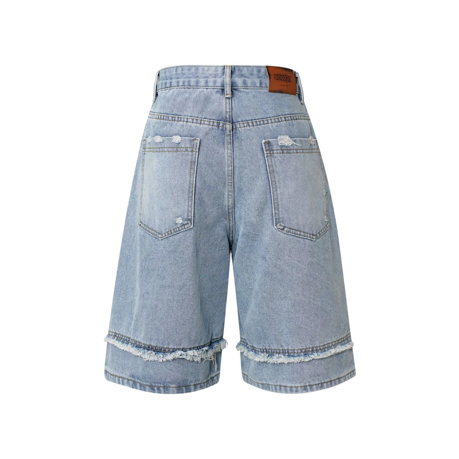 American Pu Shuai distressed denim shorts with raw-edge hem in light blue, shown on a model.