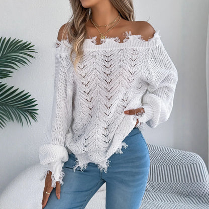 Women's black off-the-shoulder pullover sweater with hollow-out long sleeves on a hanger.