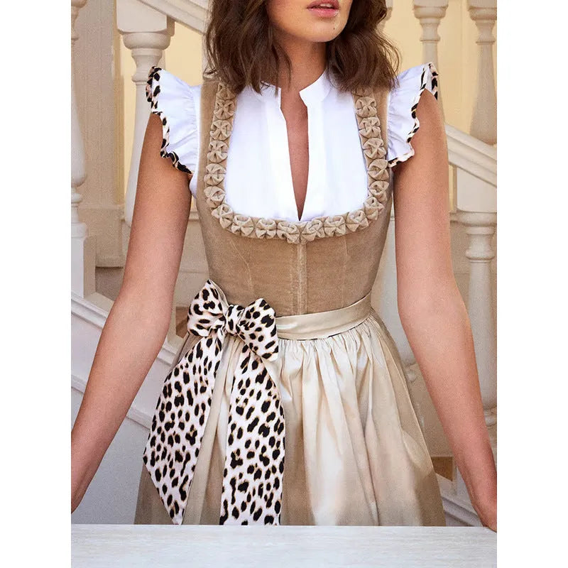 Khaki coloured women's Oktoberfest beer style dress on a hanger.