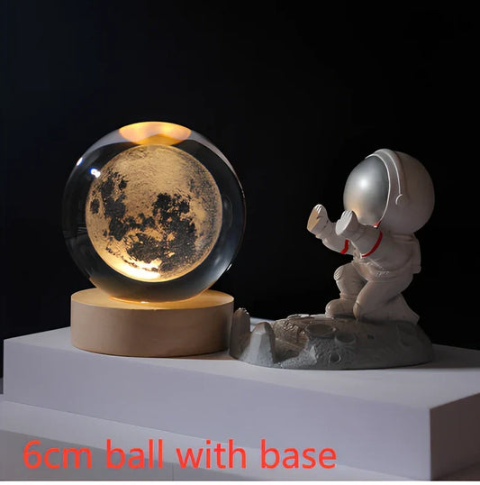 3D crystal ball night light projecting cosmic patterns from wooden base
