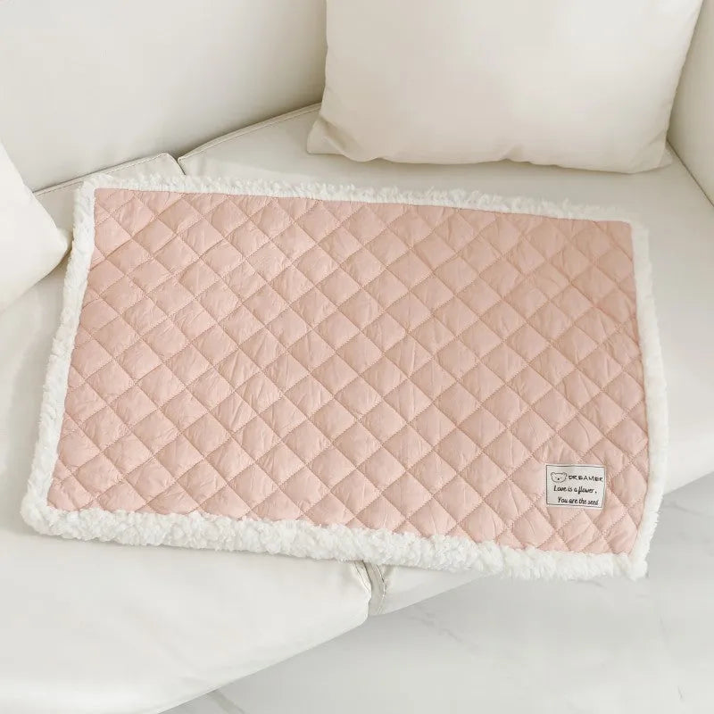 Blue quilted terry cloth pet blanket for cats shown in a cage, with size options M, L, and XL available.