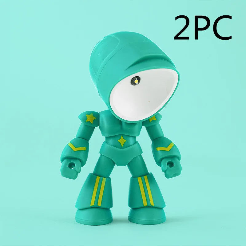 Mini mecha robot hero LED night light with adjustable arms on a desk.