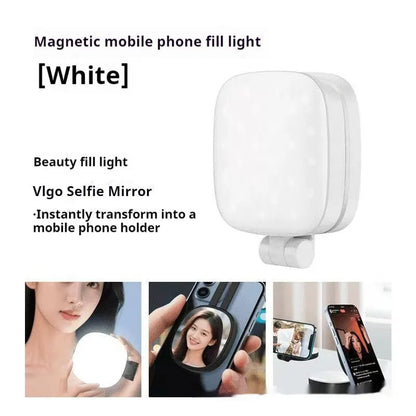 Black and white mini mobile phone fill light with magnetic holder attached to a smartphone