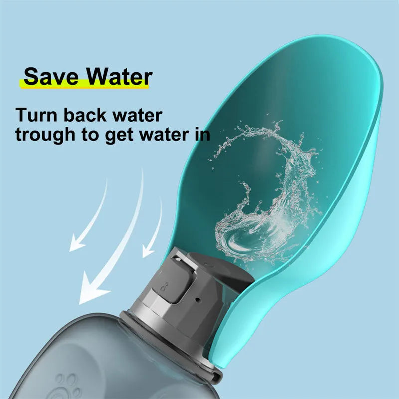 Blue grey portable dog water bottle with fold-out drinking bowl, shown with a wrist strap.