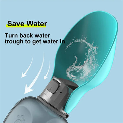 Blue grey portable dog water bottle with fold-out drinking bowl, shown with a wrist strap.