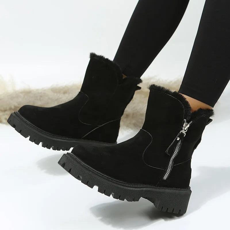 Women's black faux suede high-top snow boots with a side zipper and fur-lined collar.