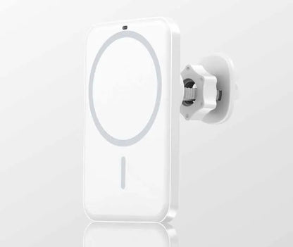 Black car magnetic wireless charging bracket mounted on air vent with phone attached