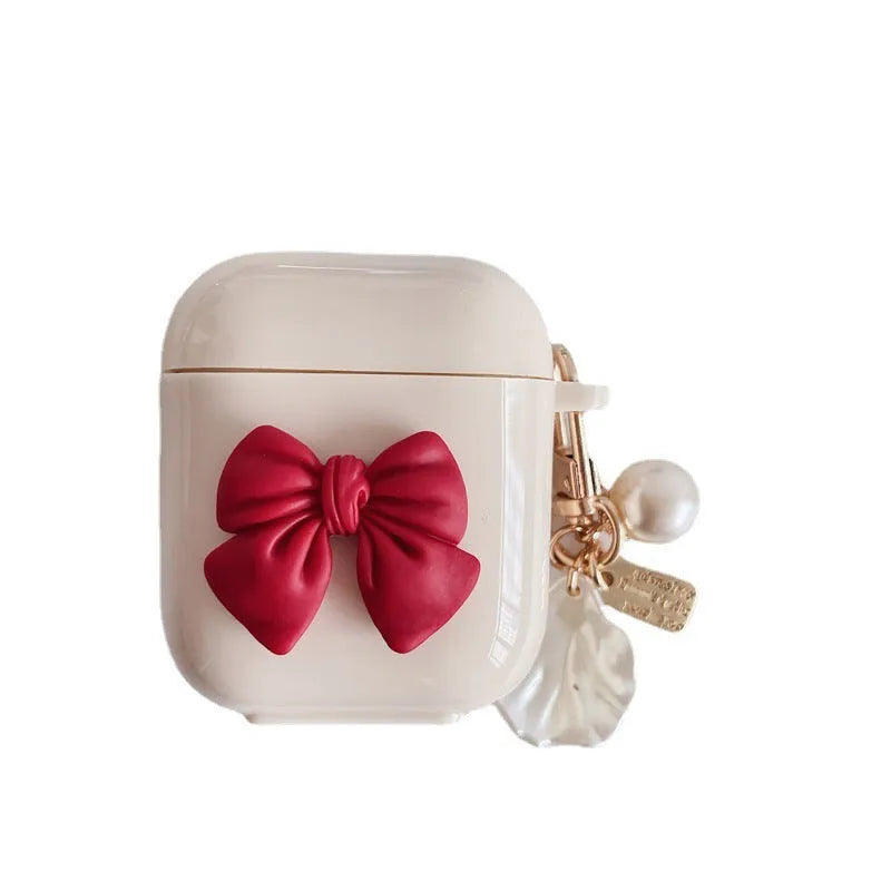 Beige red bow shell patterned TPU clamshell protective case for AirPods Pro earphones.