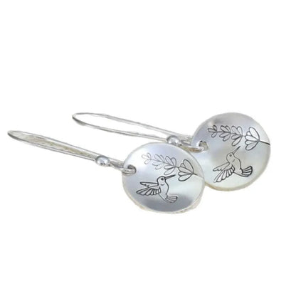 Silver zinc alloy women's earrings with glossy round shape featuring bird and flower designs