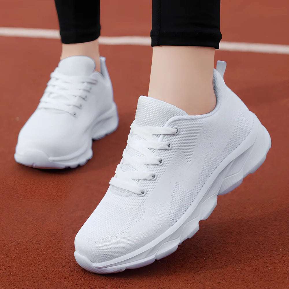 Women's black mesh running shoes with cross-strap and 3-5cm wedge heel, fabric upper with sewing details