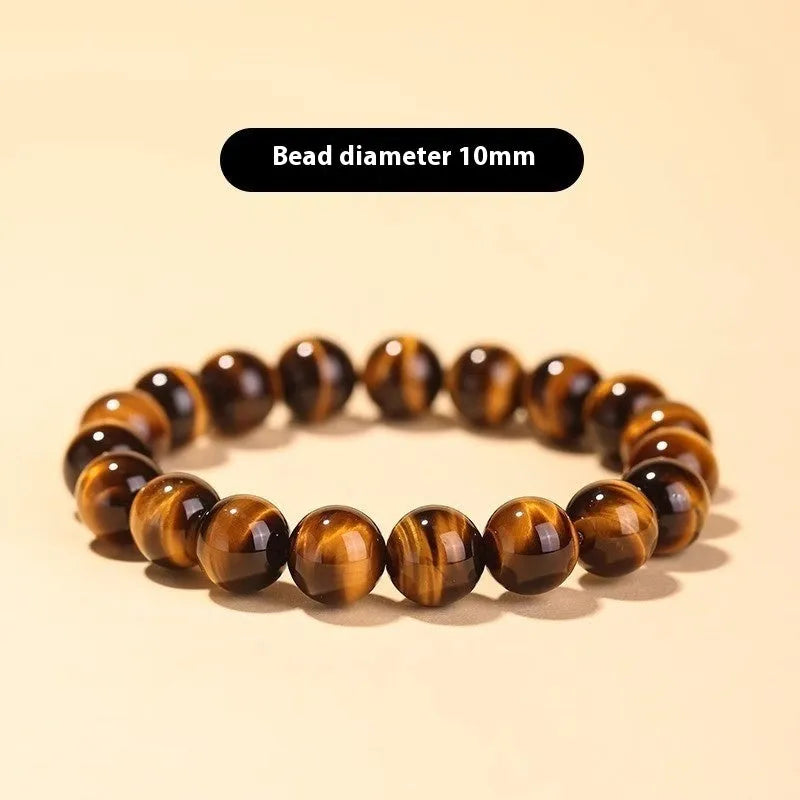 Tigereye dzi bead buddha bracelet with adjustable closure, shown in simple bracelet style.