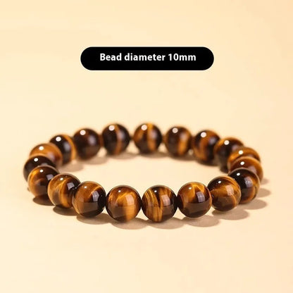 Tigereye dzi bead buddha bracelet with adjustable closure, shown in simple bracelet style.