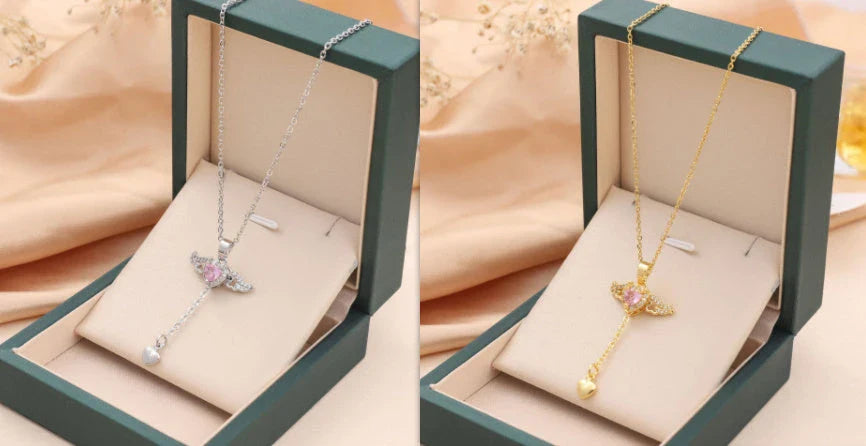 Elegant angel wings necklace with moving heart pendant, made of titanium steel and crystal accents