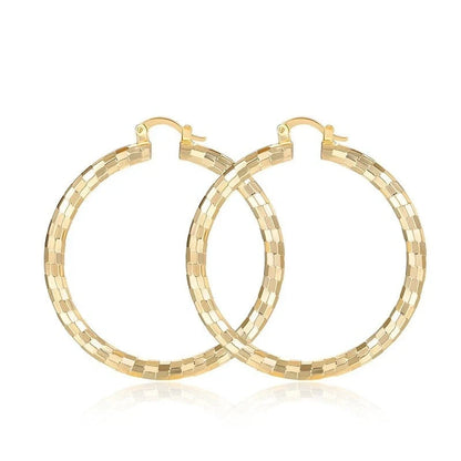 Elegant geometric copper earrings with 18-carat gold plating, featuring a minimalist elliptical design