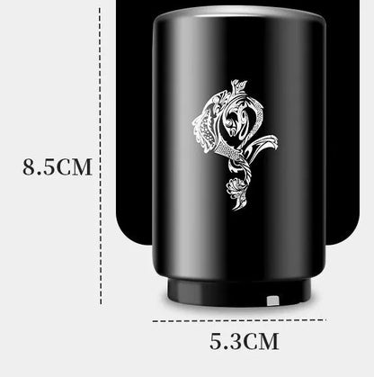 Stainless steel automatic bottle opener measuring 8.4 cm by 5.3 cm on a kitchen counter