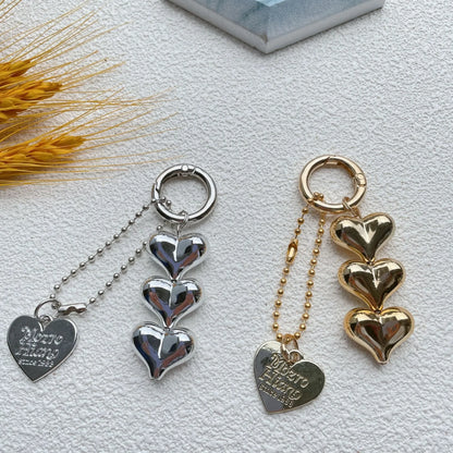Acrylic peach-shaped key ring with love heart design and electroplated finish