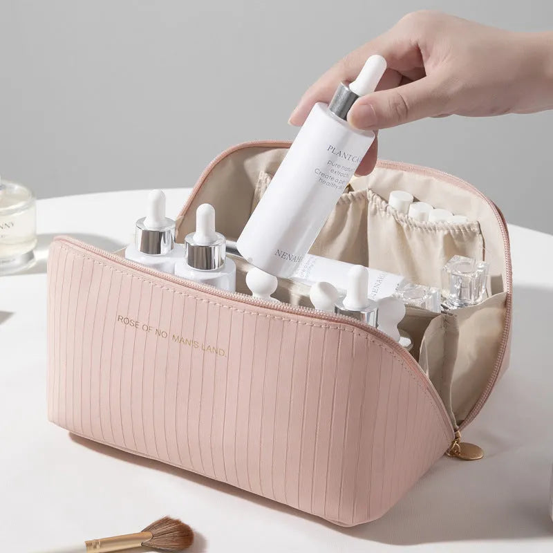 Beige cubic makeup bag with vertical pattern measuring 22.5 by 12.5 by 12.5 centimetres
