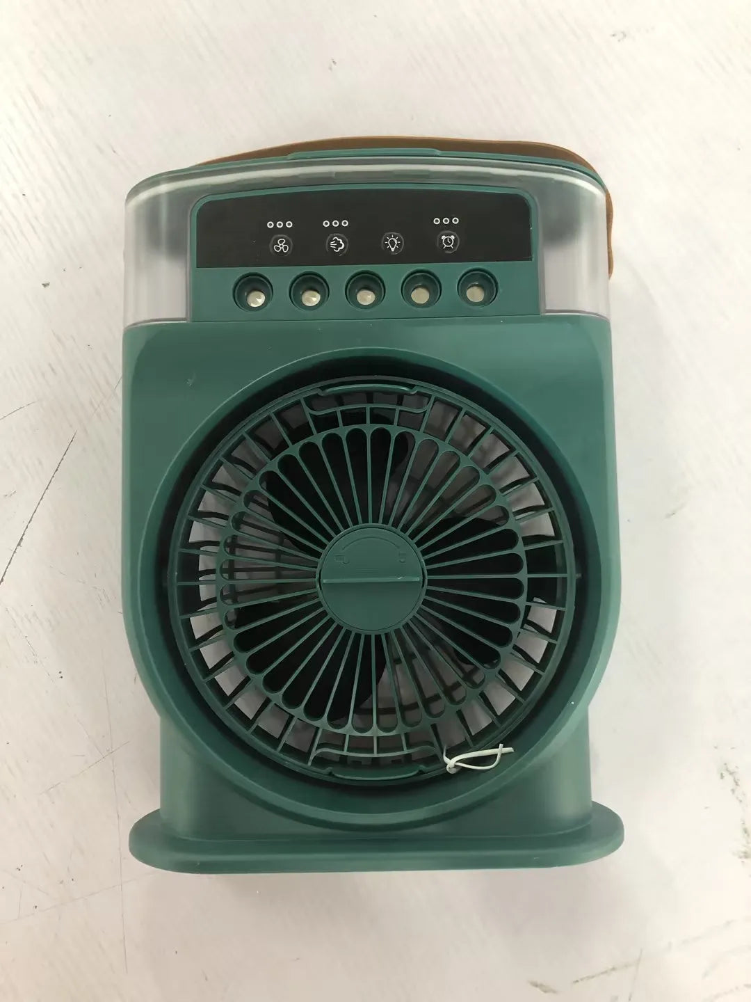 Black portable USB air cooler fan with adjustable head, leather handle, and removable water tank on a desk.